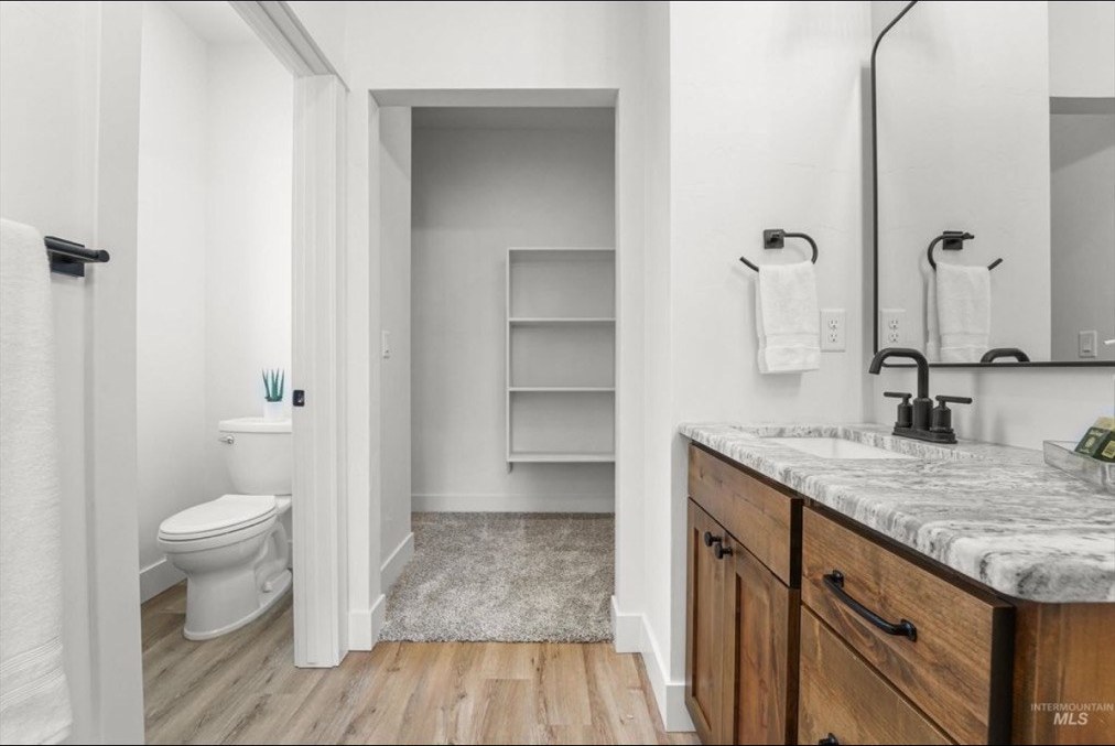Primary bathroom with double vanity and water closet