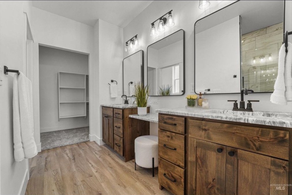 Custom dark walnut double vanity with stone counters